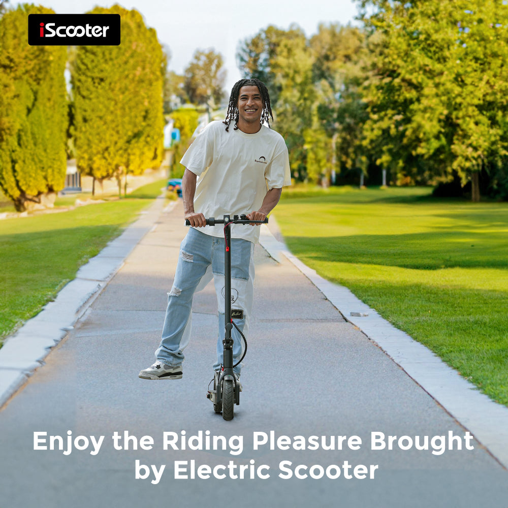 Person riding an electric scooter on a path with trees in the background, featuring the iScooter brand.