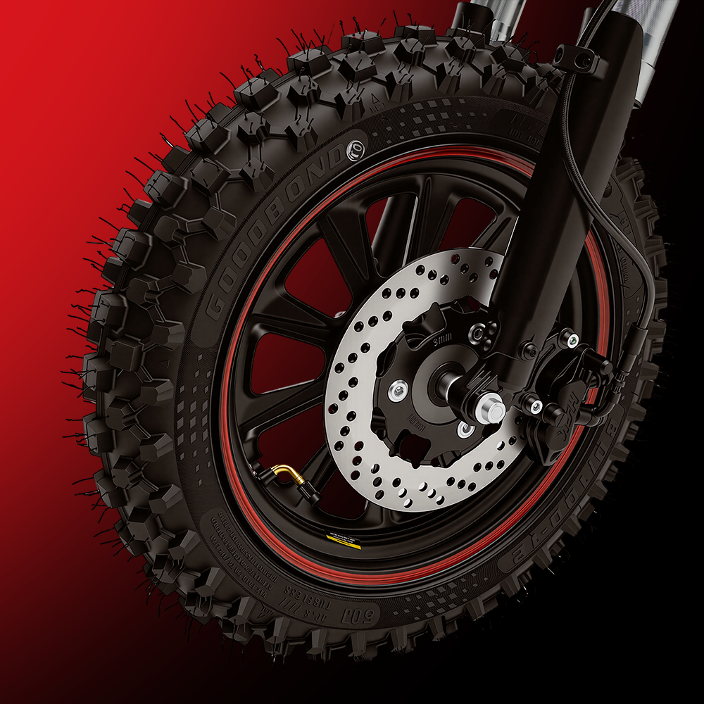 A close-up product image of an electric bike’s front wheel featuring a hydraulic disc brake system. The rugged fat tire with aggressive off-road tread is mounted on a black alloy rim with red accents, while the ventilated brake rotor and caliper are prominently displayed. Set against a red-to-black gradient background, the image emphasizes powerful braking performance, durability, and enhanced control on challenging terrain.