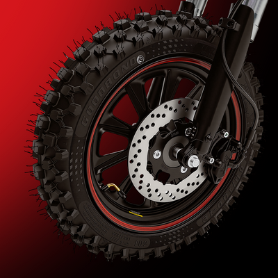 A close-up product image of an electric bike’s front wheel featuring a hydraulic disc brake system. The rugged fat tire with aggressive off-road tread is mounted on a black alloy rim with red accents, while the ventilated brake rotor and caliper are prominently displayed. Set against a red-to-black gradient background, the image emphasizes powerful braking performance, durability, and enhanced control on challenging terrain.