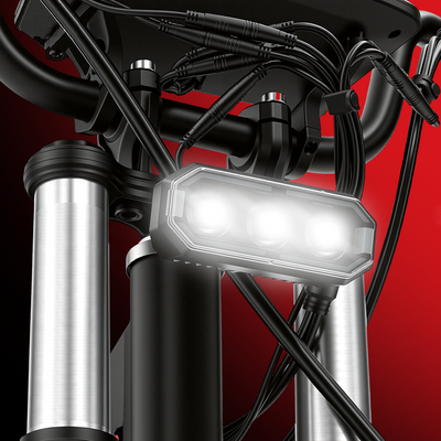 Close-up of a high-brightness LED headlight mounted on an electric scooter, providing enhanced visibility for night riding.