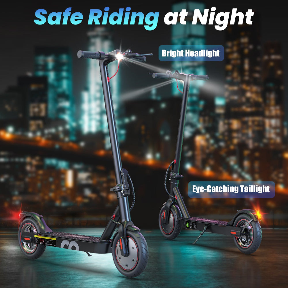 Two electric scooters with lights on a city street at night.