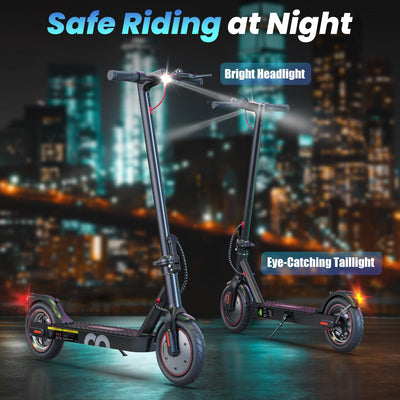 Two electric scooters with lights on a city street at night.