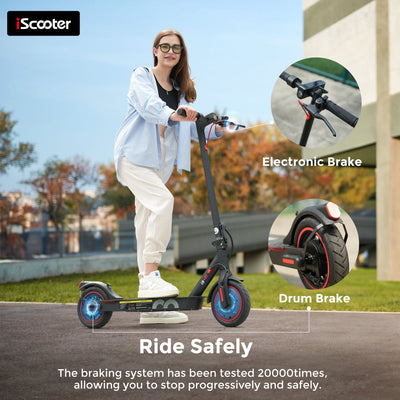 Person riding an electric scooter with brake system details on a road.