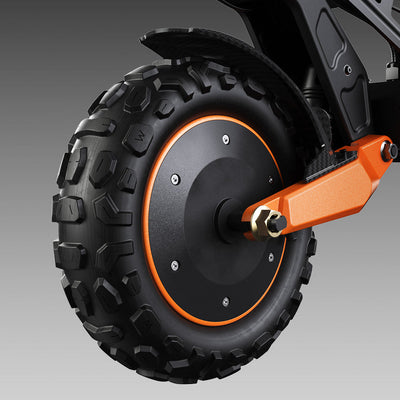 Close-up of the iScooter W12 front wheel featuring a rugged off-road tyre, integrated hub motor, orange suspension arm, and front fender, highlighting the scooter's durable all-terrain design.