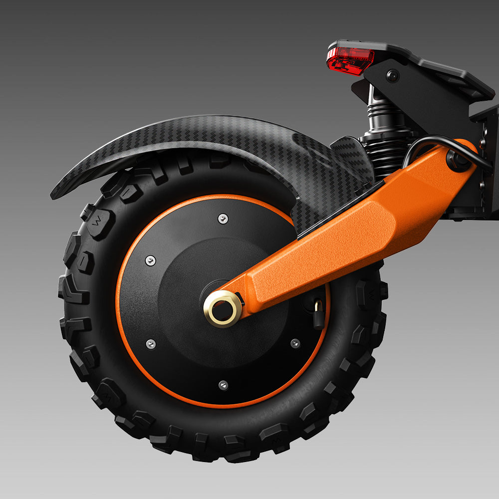 Close-up of the iScooter W12 rear wheel featuring a rugged off-road tyre, integrated hub motor, orange swing arm, rear suspension, carbon-style fender, and LED taillight, showcasing the scooter's durable all-terrain construction.