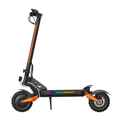 Right-side profile of a black and orange electric scooter featuring chunky off-road tires, dual suspension, and a colorful LED light strip along the deck. Shown on a white background, the image highlights the scooter’s durable frame, folding mechanism, and performance-oriented design for urban and outdoor riding.